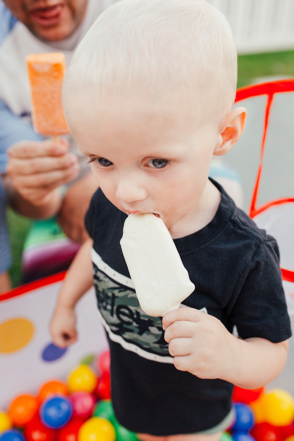 KINGS HAPPY UN-BIRTHDAY - KIDS BALL PARTY by Utah blogger Dani Marie - Little boy in Hurley shirt eating Lick'd Popsicle