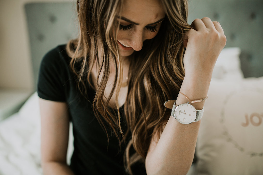 arvo watch paired with made by mary bracelet and dainty choker and necklaces light brown caramel hair loosely curled