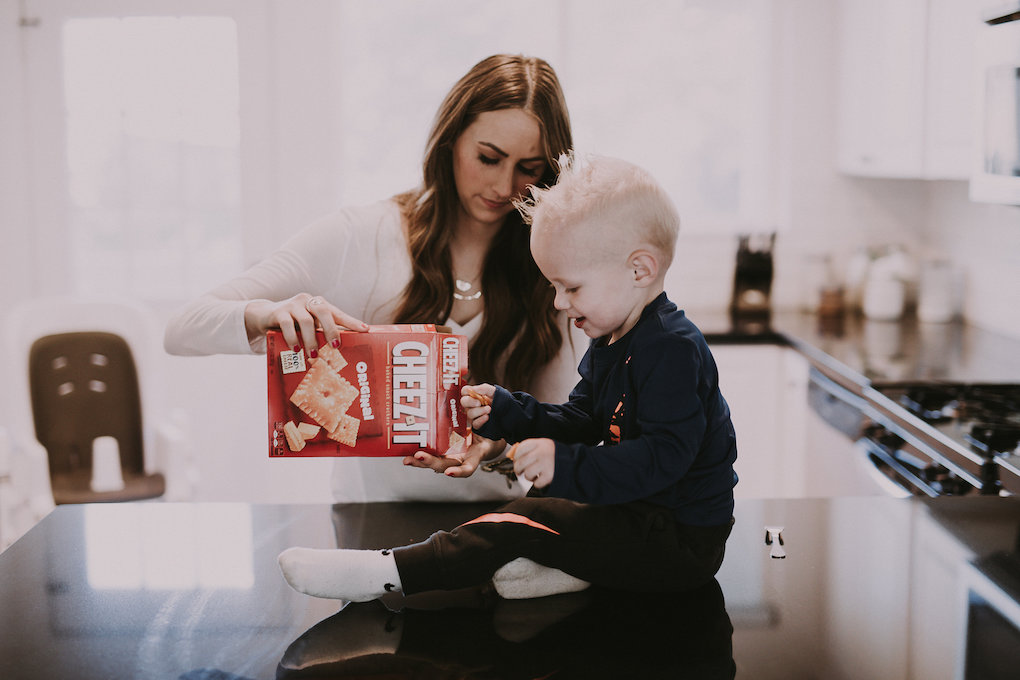 mom and little boy eating cheez-it crackers