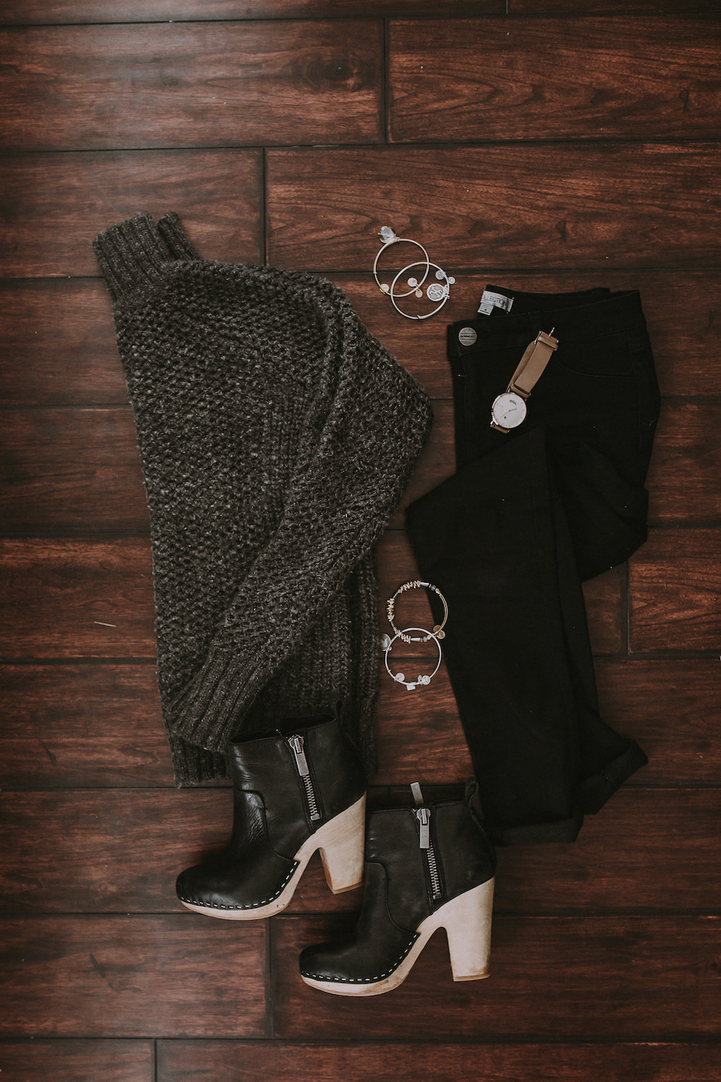 thick oversized grey knit turtleneck with black jeans and black booties