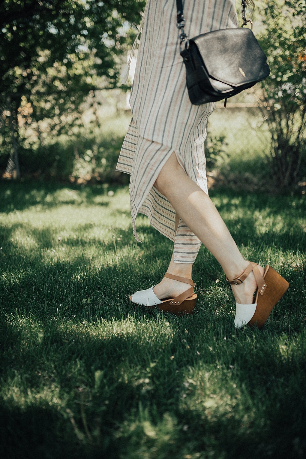 cream navy red stripe tank top maxi dress with white and tan platform sandals on long brown hair with caramel highlights black thacker nyc cross body bag